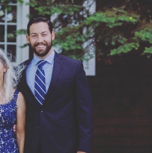 An image of Harrison in a suit.